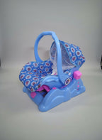 Blue baby swing with floral pattern on a tiled floor
