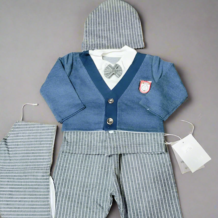 Baby outfit with blue sweater, gray pants, and matching hat on a brown background