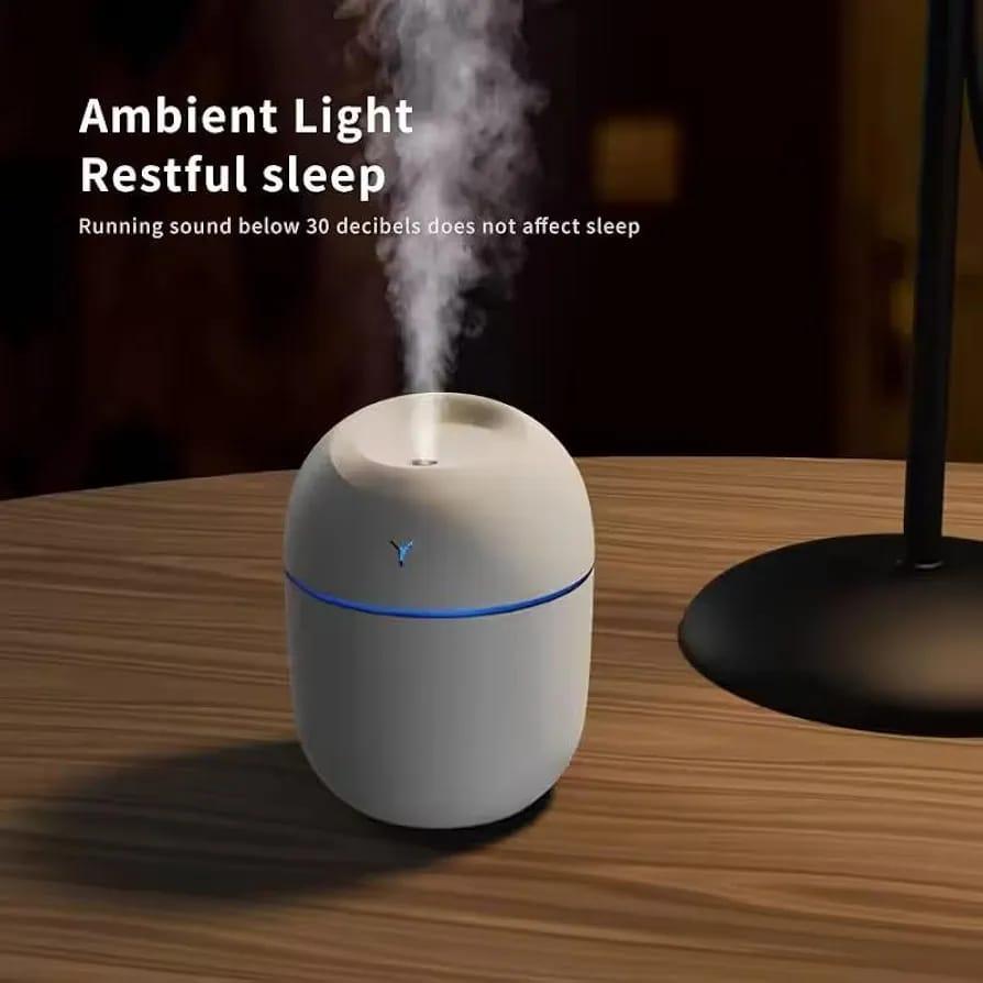 Smart Aroma Diffuser with ambient blue light on wooden table – night mode