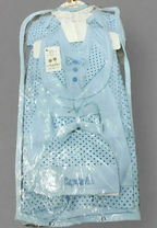 Baby carrier with blue polka dot pattern in clear packaging, brand 'Cupcake' visible.