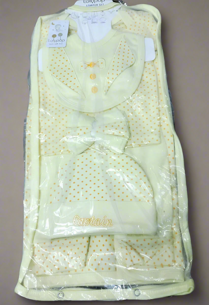 Packaged baby outfit with vest, pants, and hat in light green color.